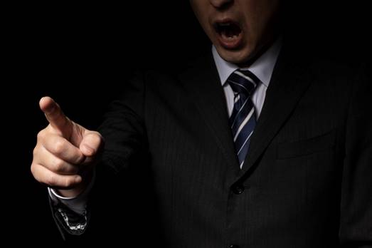 Man yelling in the dark - FMLA Retaliation